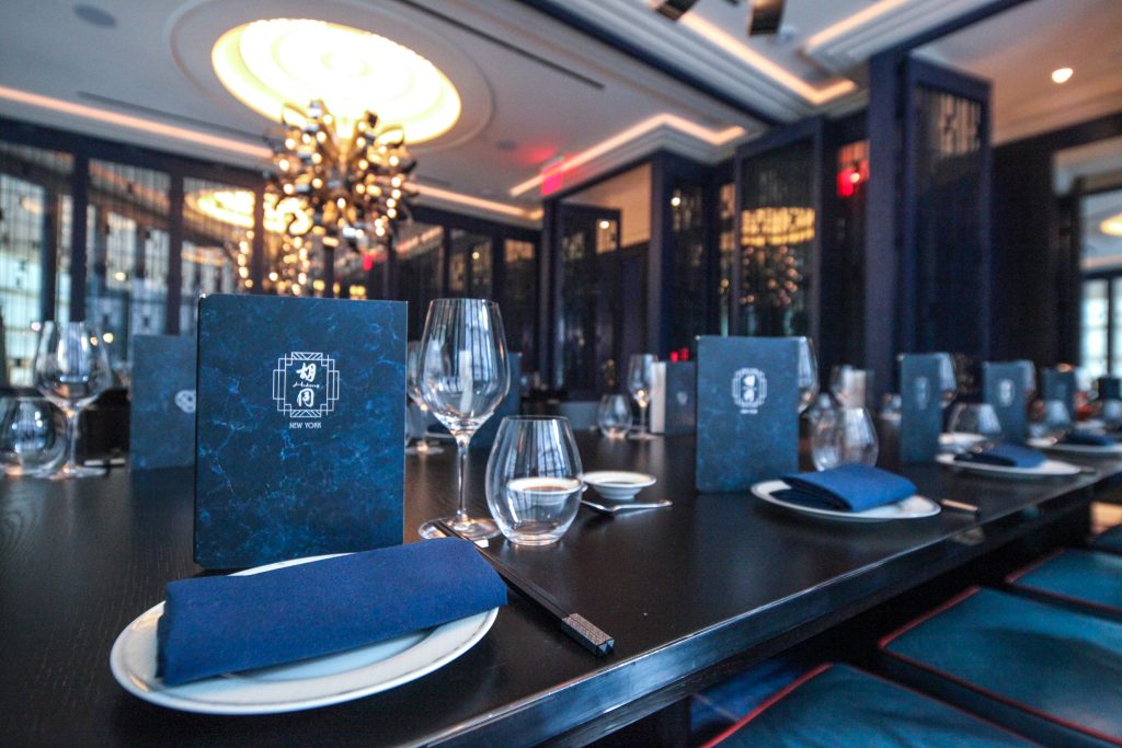 Elegant table placements set out in Hutong NYC's dining room